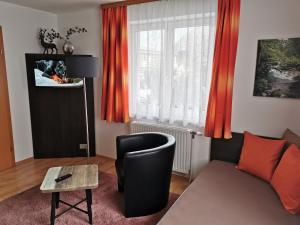 TV a/nebo společenská místnost v ubytování Haus Höll Herta