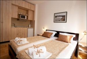 Tempat tidur dalam kamar di Belle Apartments - Luxury Apartments