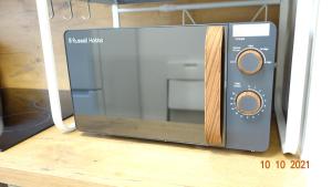a microwave oven sitting on top of a table at Apartment Weberstrasse in Tübingen