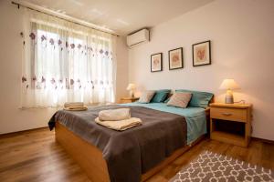 a bedroom with a large bed and a window at Apartment in Rovinj/Istrien 11481 in Štanga