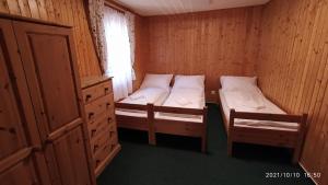 Postel nebo postele na pokoji v ubytování Penzion U Rybníka