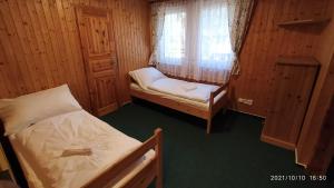 Postel nebo postele na pokoji v ubytování Penzion U Rybníka