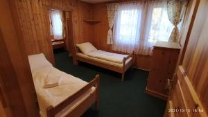 Postel nebo postele na pokoji v ubytování Penzion U Rybníka