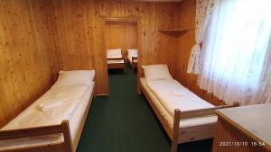 Postel nebo postele na pokoji v ubytování Penzion U Rybníka