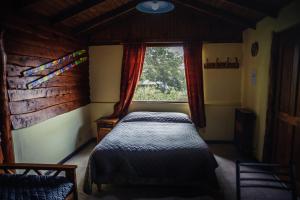 A bed or beds in a room at Cabaña Bariloche