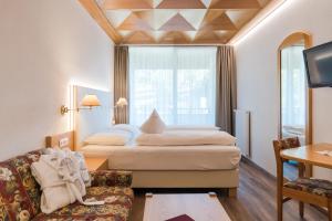 Postel nebo postele na pokoji v ubytování Hotel Theresia