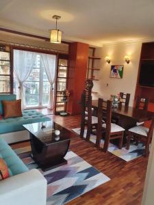 a living room with a table and a dining room at LA REALEZA Apartamento in La Paz +38 photos