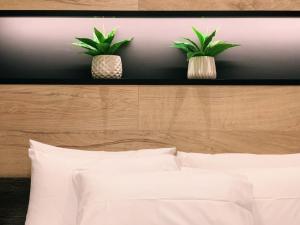 Ένα ή περισσότερα κρεβάτια σε δωμάτιο στο Luxury Townhouse Suite