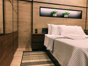Ένα ή περισσότερα κρεβάτια σε δωμάτιο στο Luxury Townhouse Suite