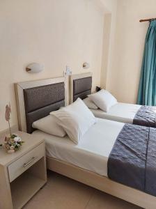 A bed or beds in a room at Antonio Studios