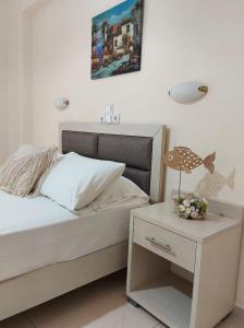 A bed or beds in a room at Antonio Studios