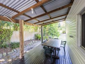 
a patio area with a patio table and chairs at Long Haven in Iluka
