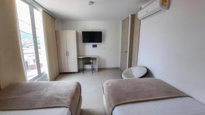 Voodi või voodid majutusasutuse Bayit Tov Circunvalar Hotel toas