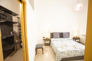 A bed or beds in a room at Sol&Luna 1909 Tourist Location in Old Town