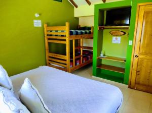 Postel nebo postele na pokoji v ubytování Hotel Cabañas San Cayetano
