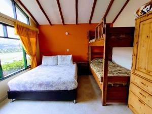 Postel nebo postele na pokoji v ubytování Hotel Cabañas San Cayetano