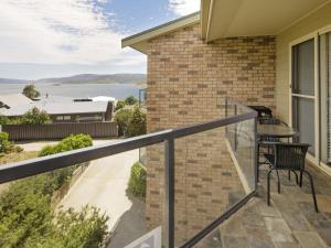 a balcony with a view of the water at Caribou 3 Views over Lake Jindabyne with Wifi in Jindabyne