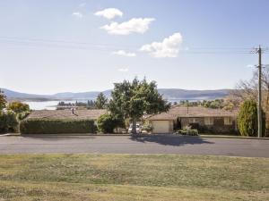 a house on a street with a driveway at Cascades 3 Well Appointed and Central location in Jindabyne