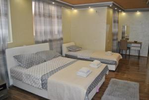 A bed or beds in a room at Rooms " SIMKE " Subotica