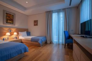 A bed or beds in a room at Alexandar Montenegro Luxury Suites & Spa