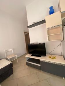 a living room with a tv on a table at eri apartament in Himare