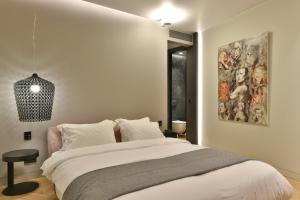 Postel nebo postele na pokoji v ubytování Athens Dom Hotel