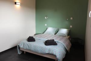 Ένα ή περισσότερα κρεβάτια σε δωμάτιο στο L'AYMERAUDE