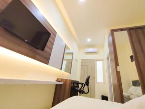 TV a/nebo společenská místnost v ubytování La Tana Hotel + 16 fotografií