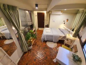 a hospital room with two beds and a balcony at Home16 Sukhumvit16 in Bangkok