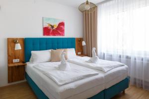 Posteľ alebo postele v izbe v ubytovaní Pension Laubenhof