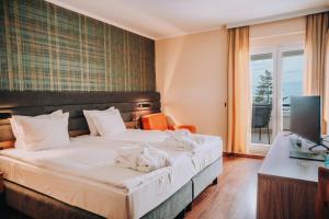 Postel nebo postele na pokoji v ubytování Inex Olgica Hotel & SPA