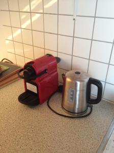a tea kettle and a toaster sitting on a counter at Paulus Gästehaus Top3 in Salzburg