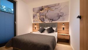 Postel nebo postele na pokoji v ubytování Kalinowa z sauną, Sun & Snow