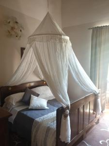 Postel nebo postele na pokoji v ubytování ABBAZIA SS. QUIRICO E GIULITTA