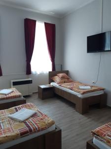 Postel nebo postele na pokoji v ubytování Helga Apartman