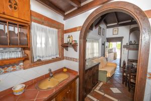 a bathroom with a sink in a room at Tu Villa Rural Los Cantos 7 Dormitorios in Alhaurín el Grande