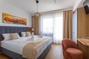 Posteľ alebo postele v izbe v ubytovaní Pension Laubenhof