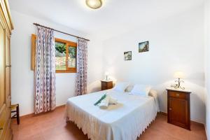 Postel nebo postele na pokoji v ubytování Villa Son Allarga