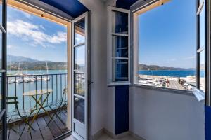 a balcony with a view of the water at Casa Nostra : bienvenue chez nous ! in Saint-Florent