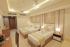 Krishnavalsam Regency客房内的一张或多张床位