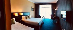 Ένα ή περισσότερα κρεβάτια σε δωμάτιο στο EHSAN SEAVIEW HOTEL PORT DICKSON