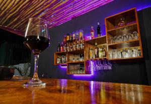 ein Glas Wein auf einem Tisch in einer Bar in der Unterkunft Karanga River Lodge in Moshi