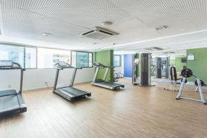 a gym with treadmills and ellipticals in a room at BEACH CLASS EXECUTIVE apto 206 in Recife