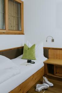 Postel nebo postele na pokoji v ubytování Hotel Tauernhof