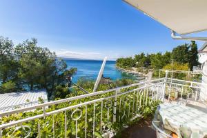 a balcony with a view of the water at Apartment Tina in Starigrad-Paklenica