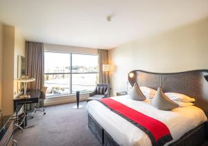 A bed or beds in a room at Brooklands Hotel & Spa 