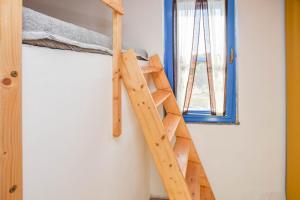 Palanda nebo palandy na pokoji v ubytování House Serenity