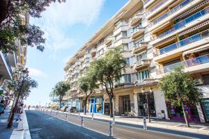 an empty street in front of a tall building at PALAIS PROMENADE AP4166 Nice, by Riviera Holiday Homes in Nice