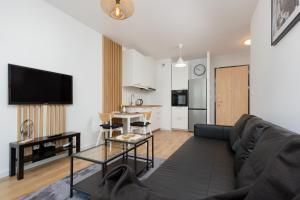 Kuchyňa alebo kuchynka v ubytovaní Forum Wola Jana Kazimierza Apartment by Noclegi Renters
