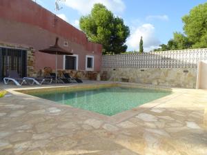 a swimming pool in the backyard of a house at Huerto Espuña in Totana